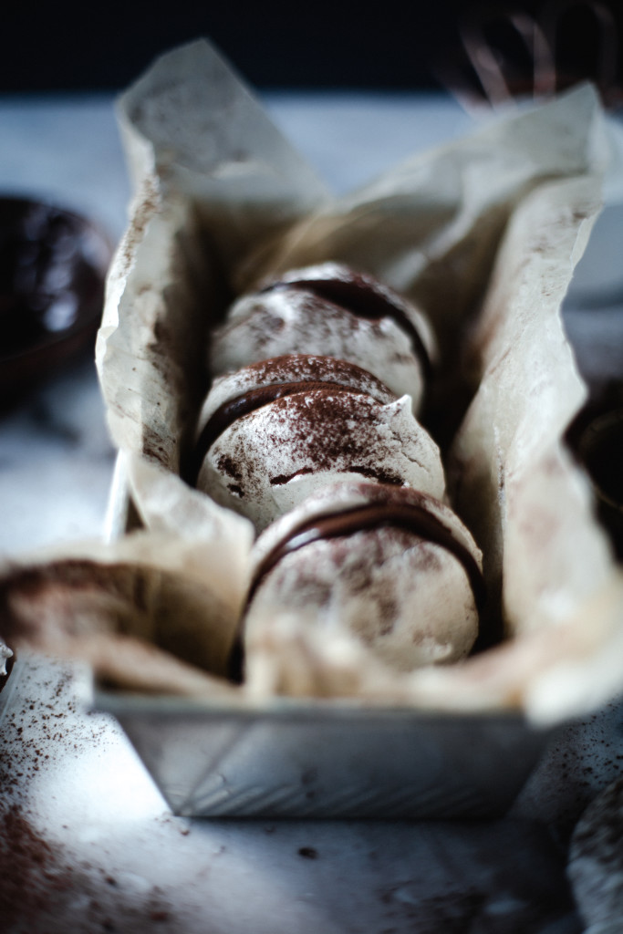 vanilla meringues with dark chocolate ganache // ohhoneybakes.com